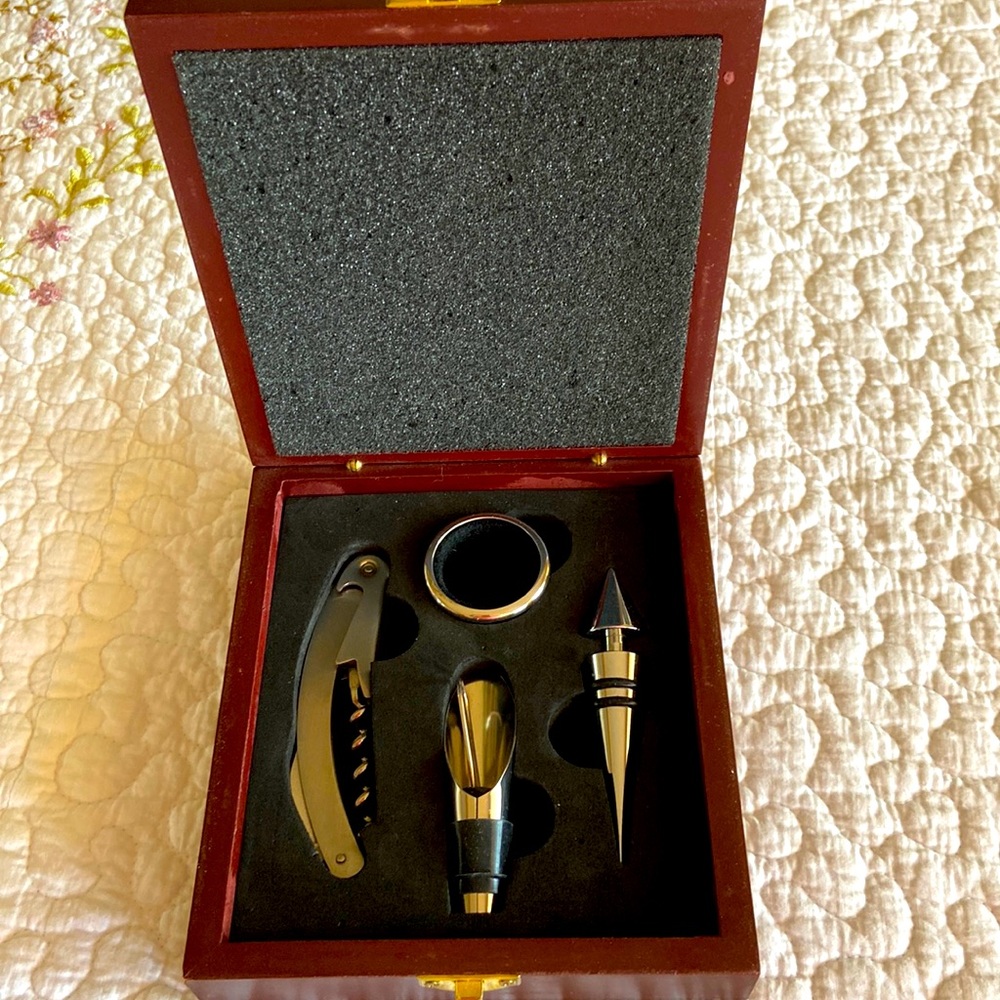 Gently used boxed wine opener set